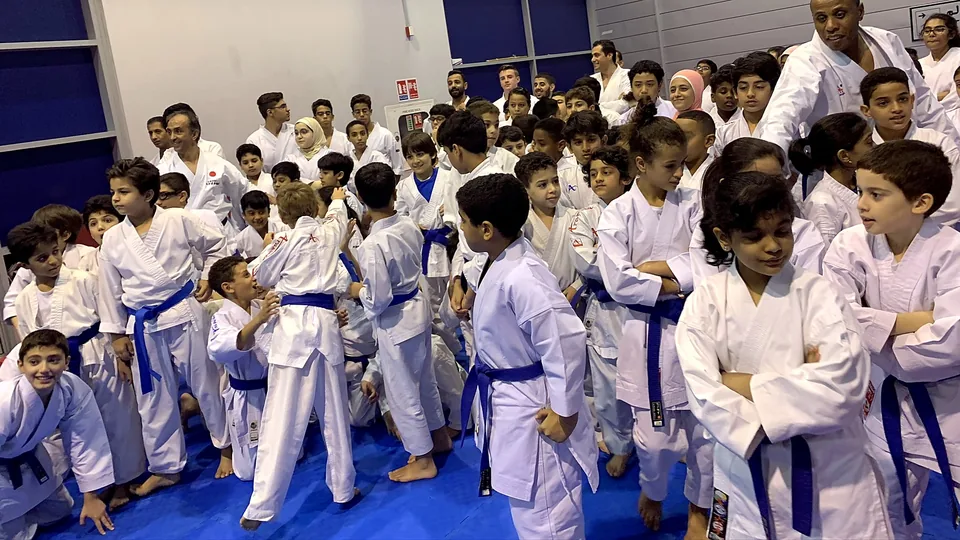 Hundreds of young karateka at a karate event in Qatar