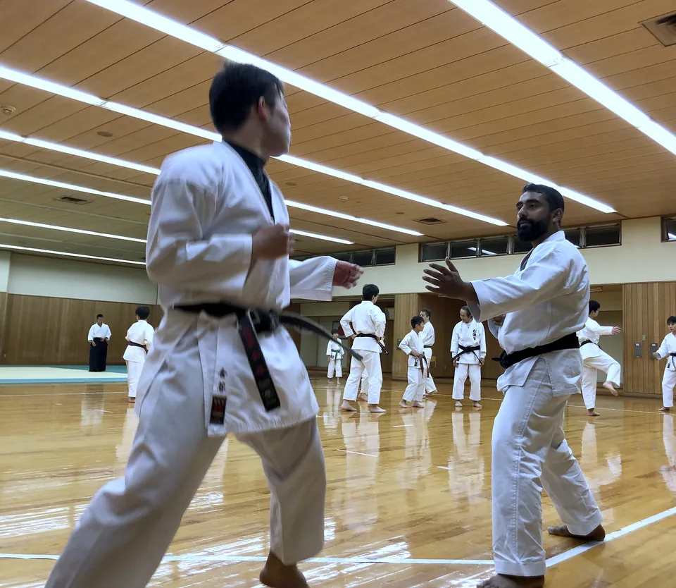 Sensei Najmal partner training with a Japanese instructor in Japan